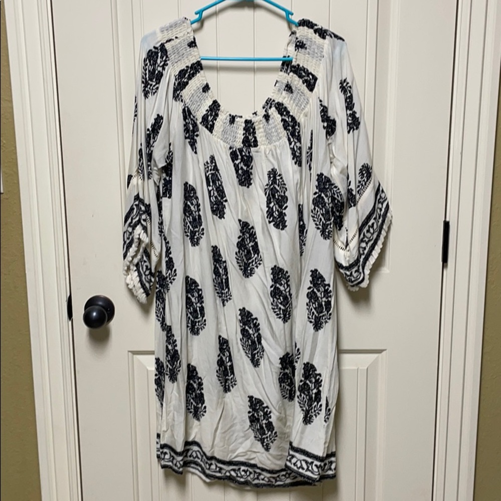 Off shoulder cream and black dress